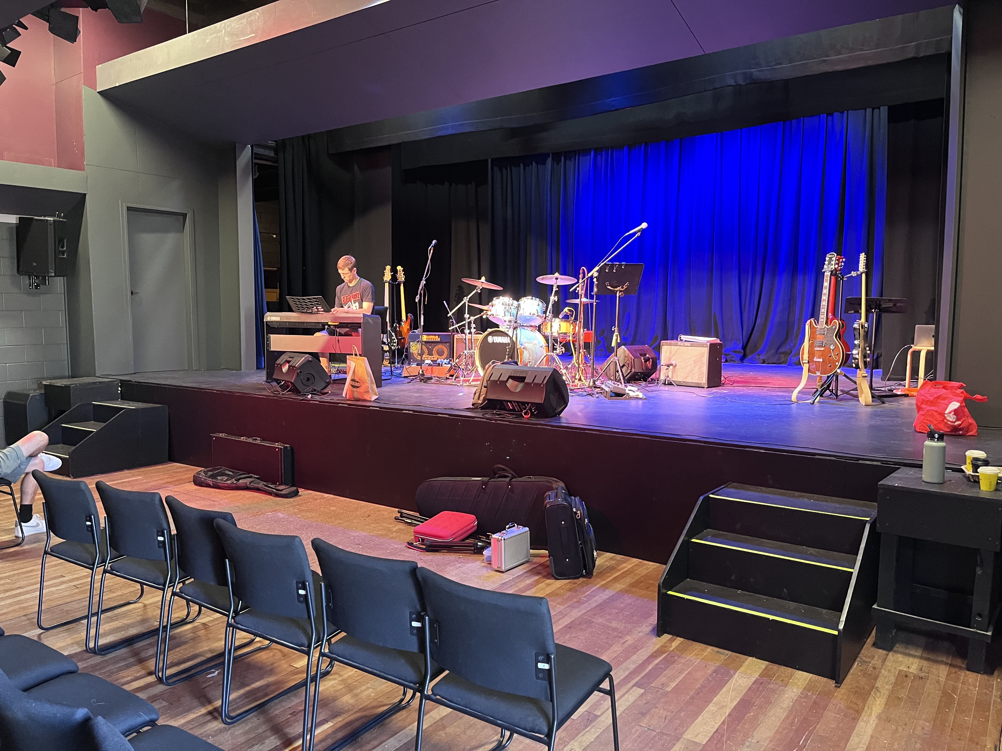 Setting up keys and drums before the show